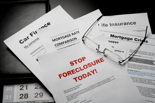 Mortgage,News,Papers,And,Eye,Glasses,On,The,Table - Stop Foreclosure and Save Your Home Foreclosure Defense Group